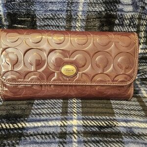 Purple Coach embossed wallet